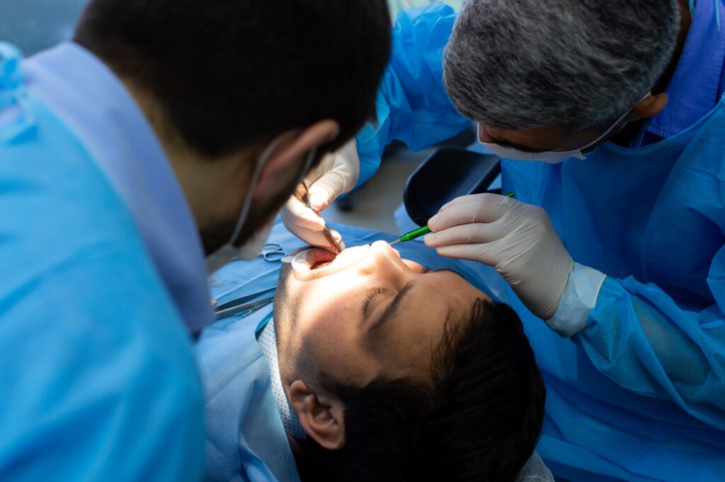 dentist and assistant during surgery at the dental clinic in oxnard